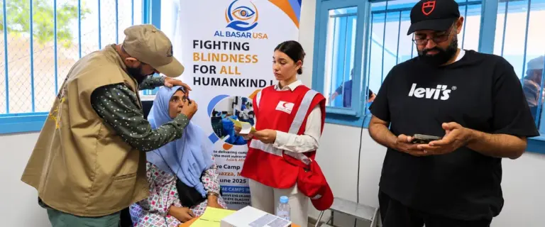 Al Basar USA team helping a patient at a mobile eye camp