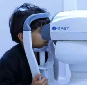 Waseem receiving an eye examination